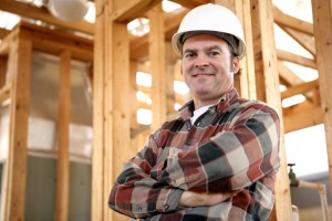 A handsome, friendly construction worker on the job site