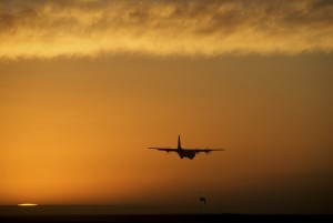 Military plane C130 flying during a sunset in Afghanistan.
