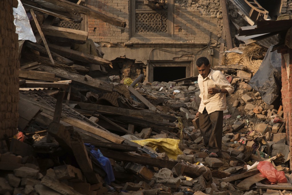 Man saves what he can after earthquake in Nepal.