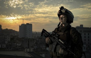 Military girl in uniform of the U.S. Army looks into the distance.