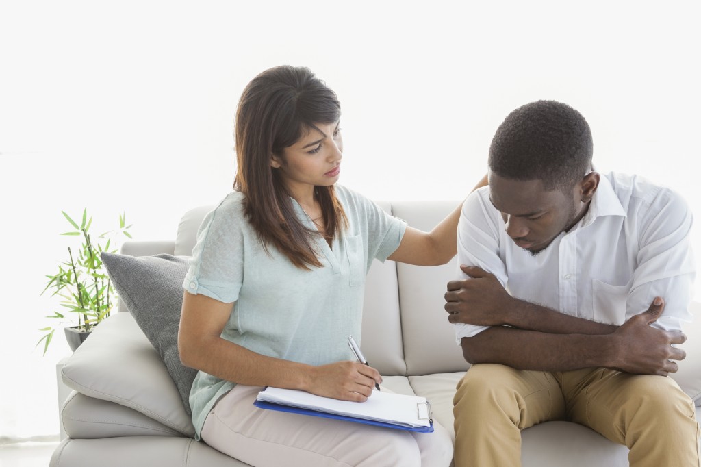 Therapist reassuring her upset patient