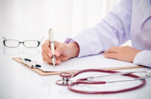 doctor writing medical record